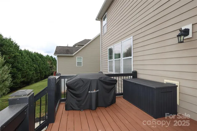 a balcony with wooden floor and furniture