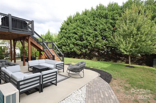 a view of a patio with a table and chairs