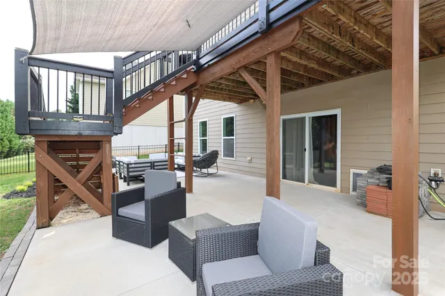 a view of living room kitchen and dining room