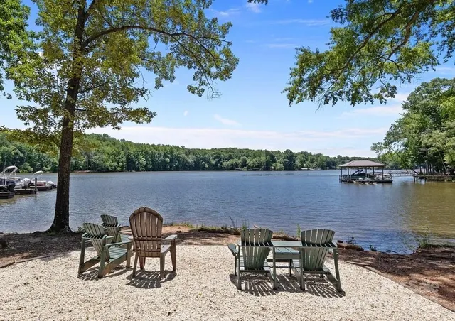 a view of lake from deck with patio
