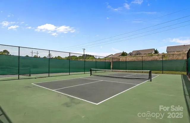 a view of an outdoor space and tennis court