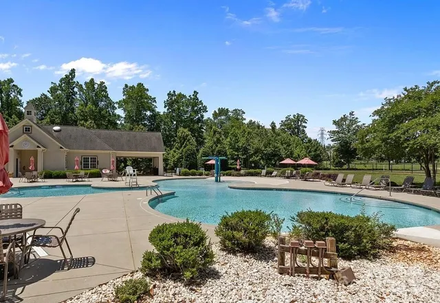 a view of a swimming pool and lounge chair