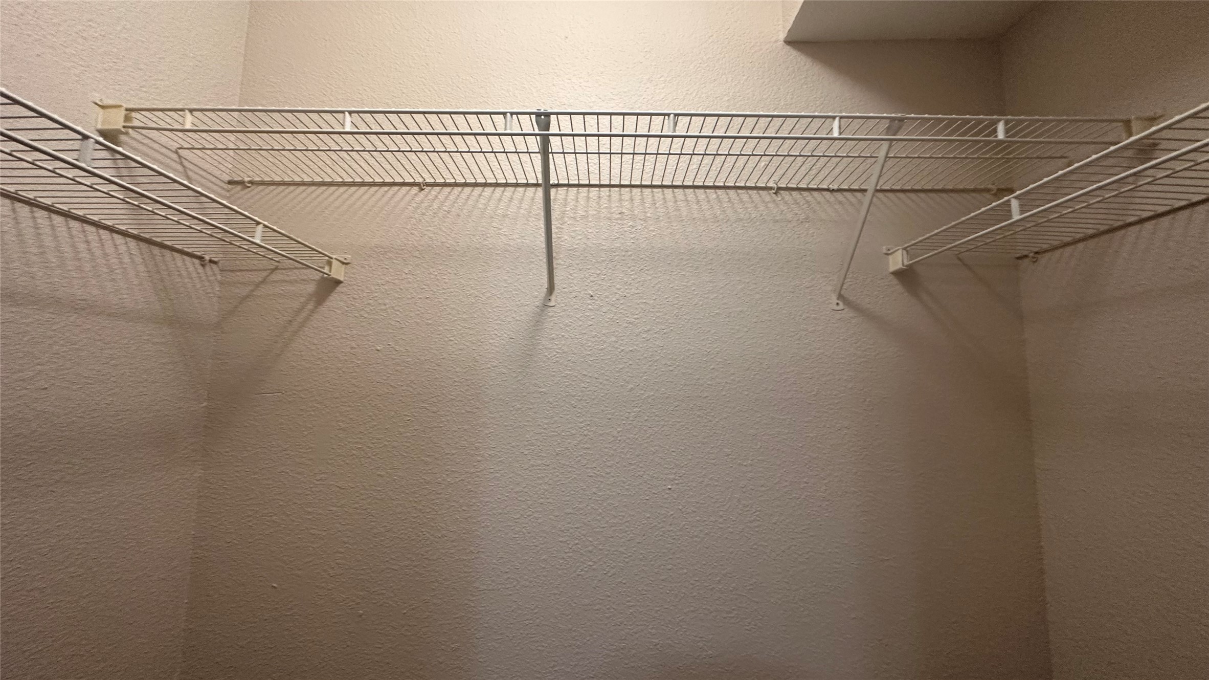 7315 Brompton Street, Unit 303B Houston, TX 77025 - Photo 7 of 14 a view of a room with racks on the wall