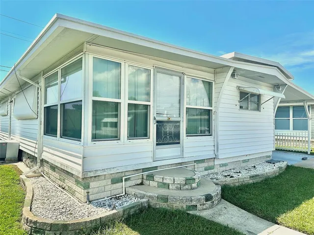 a view of house with yard