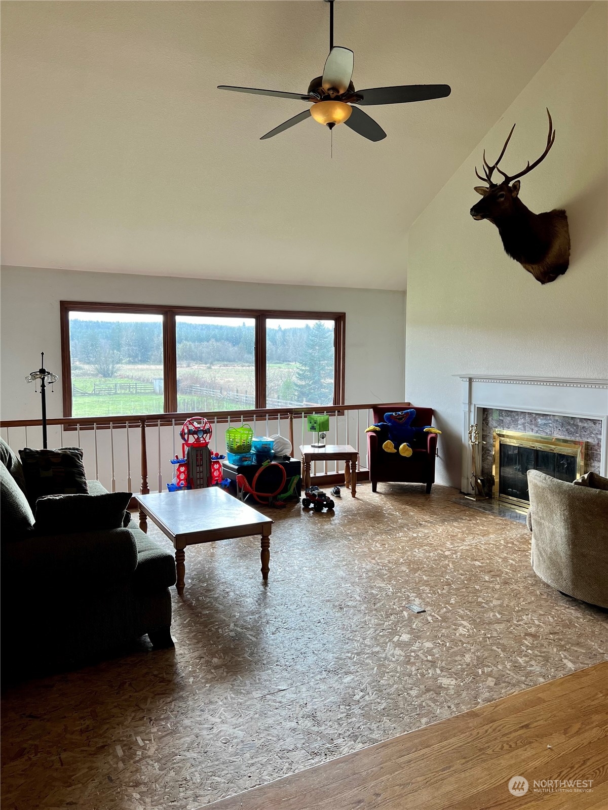 32 889 Elma, WA 98541 - Photo 11 of 29 a living room with furniture a window and a flat screen tv