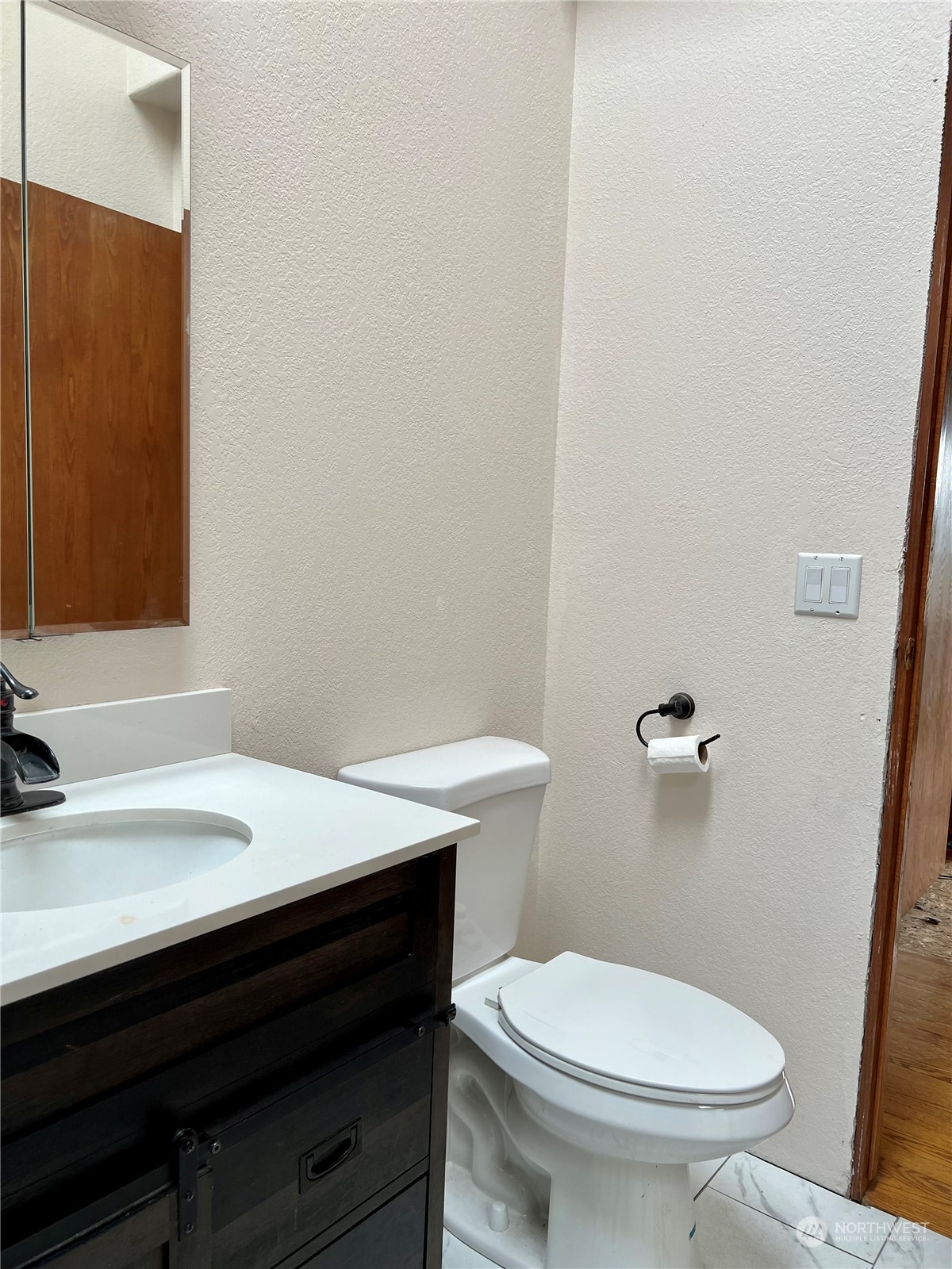 32 889 Elma, WA 98541 - Photo 13 of 29 a bathroom with a sink and a toilet