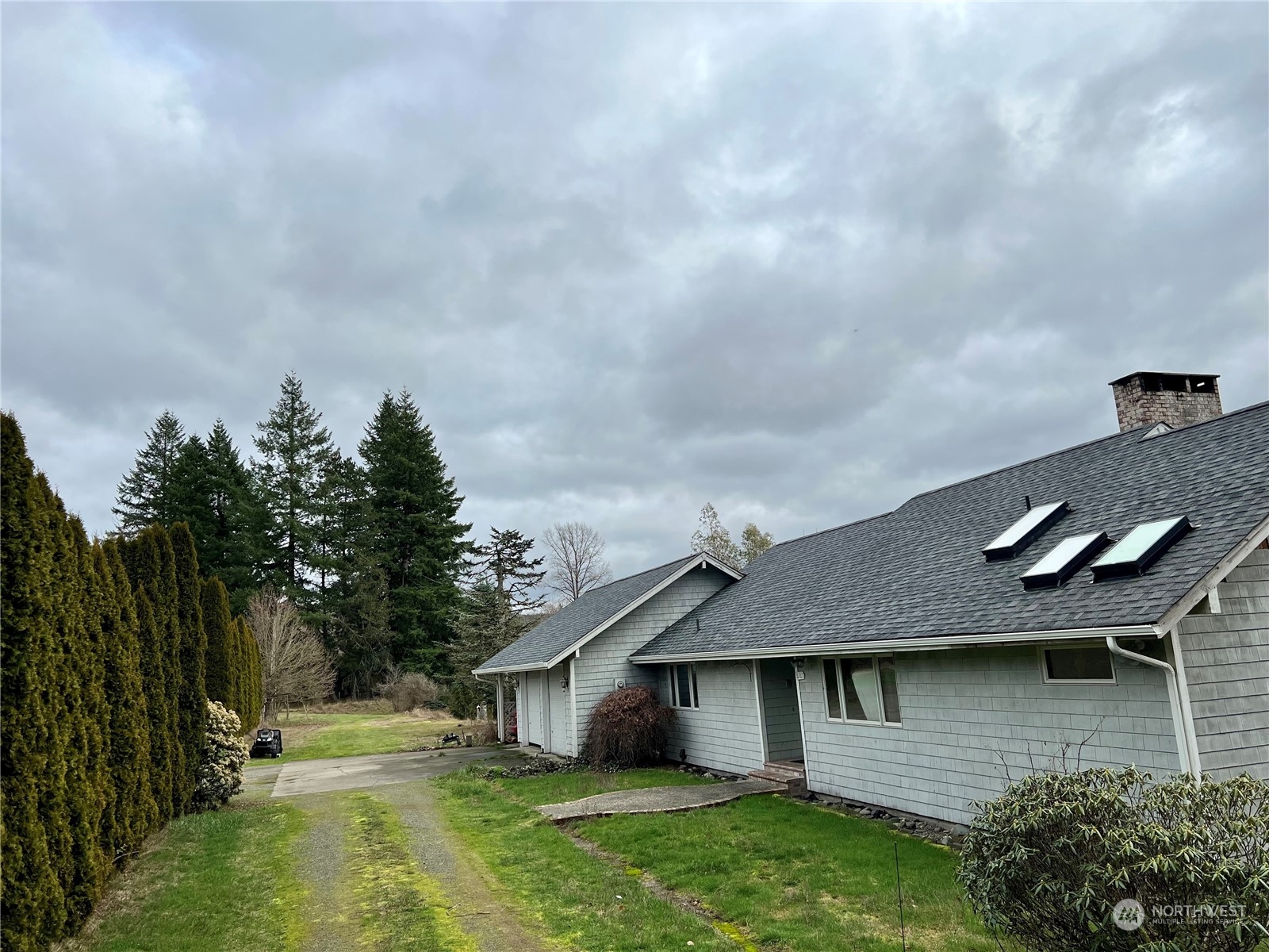 32 889 Elma, WA 98541 - Photo 2 of 29 a aerial view of a house with a yard table and chairs