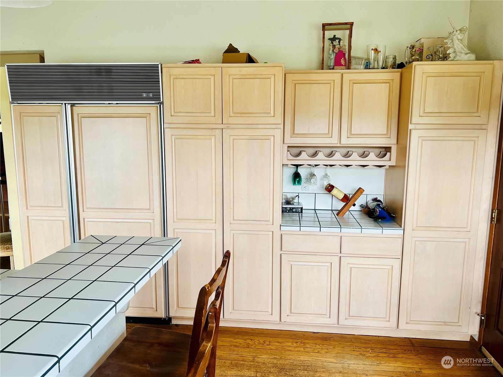 32 889 Elma, WA 98541 - Photo 9 of 29 a kitchen with stainless steel appliances a white refrigerator a stove top oven and a dining table with wooden floor