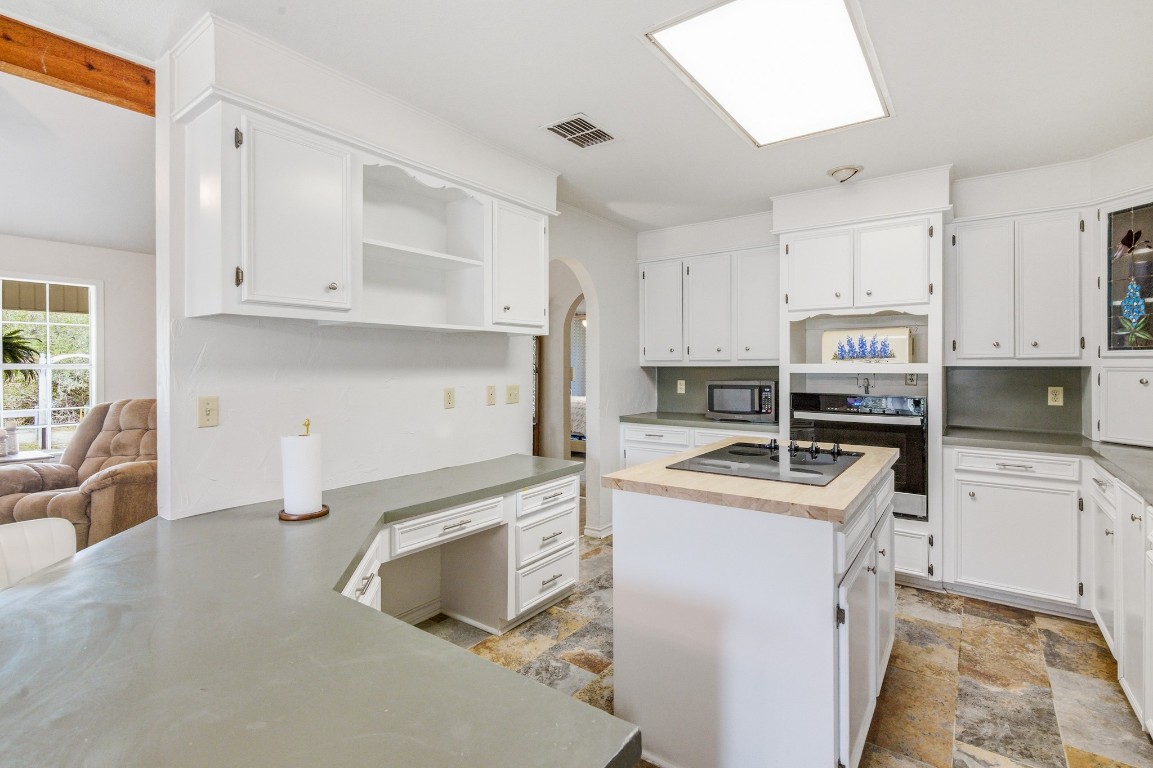 11847 Friar Road Cuero, TX 77954 - Photo 28 of 50 a kitchen with a sink cabinets and appliances