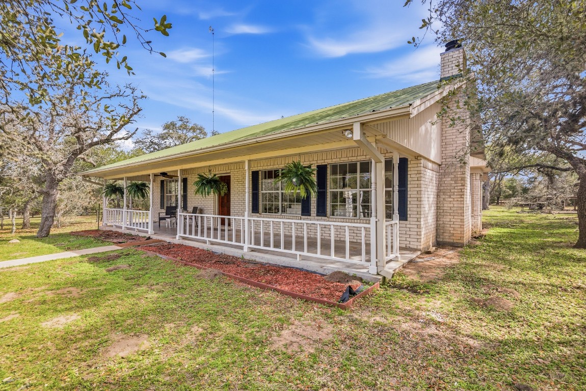 11847 Friar Road Cuero, TX 77954 - Photo 4 of 50 a view of a house with a yard and porch