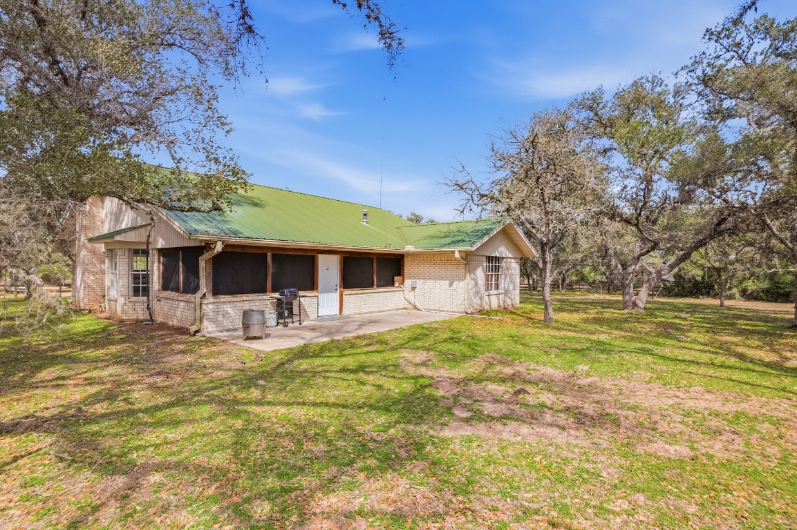 11847 Friar Road Cuero, TX 77954 - Photo 8 of 50 a front view of a house with a garden and trees
