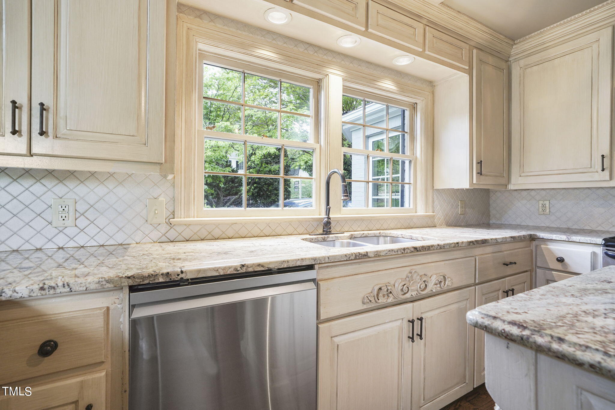 3100 Eton Road Raleigh, NC 27608 - Photo 12 of 45 a kitchen with granite countertop a sink and a window