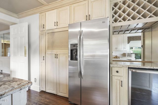a kitchen with granite countertop a sink and a window