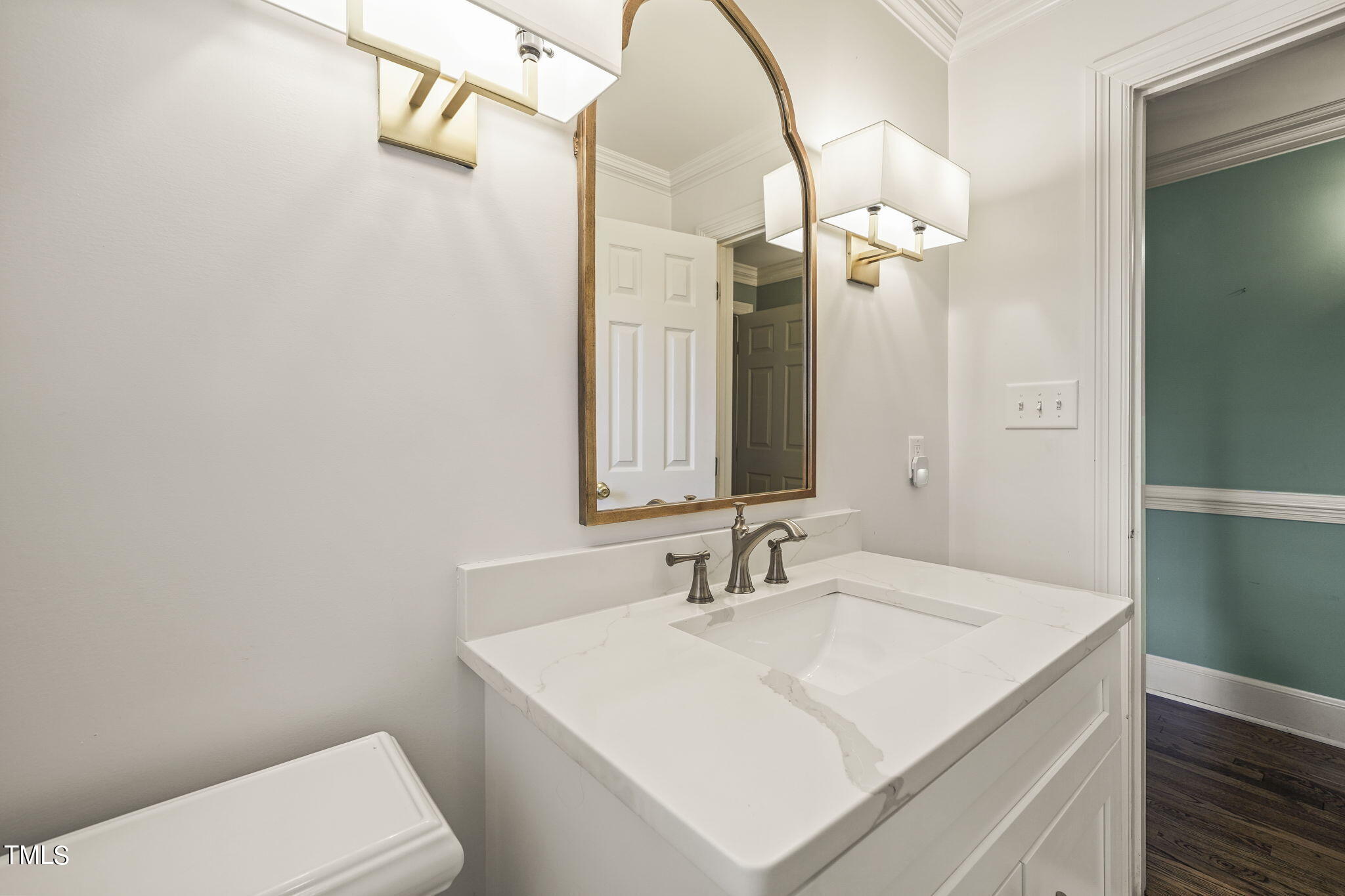3100 Eton Road Raleigh, NC 27608 - Photo 20 of 45 a bathroom with a sink a toilet and a mirror