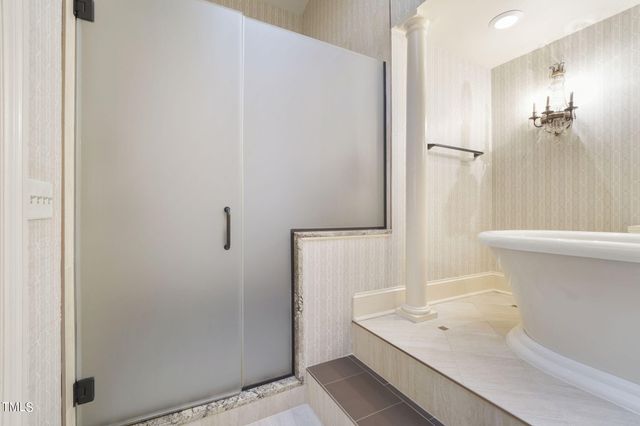 a bathroom with a sink mirror and toilet