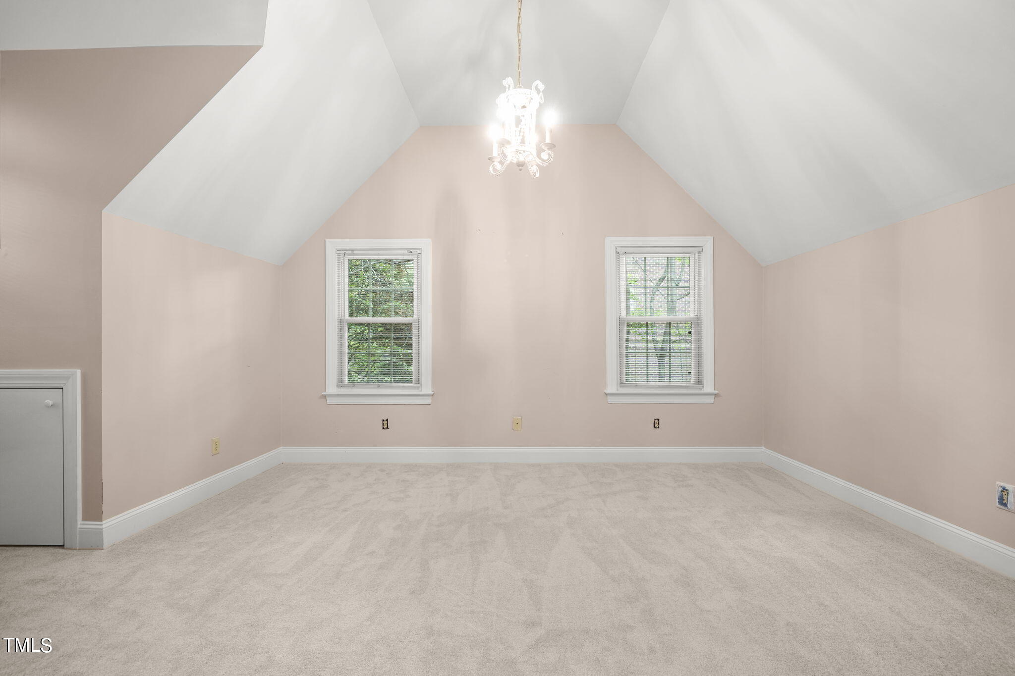 3100 Eton Road Raleigh, NC 27608 - Photo 31 of 45 an empty room with windows and chandelier fan