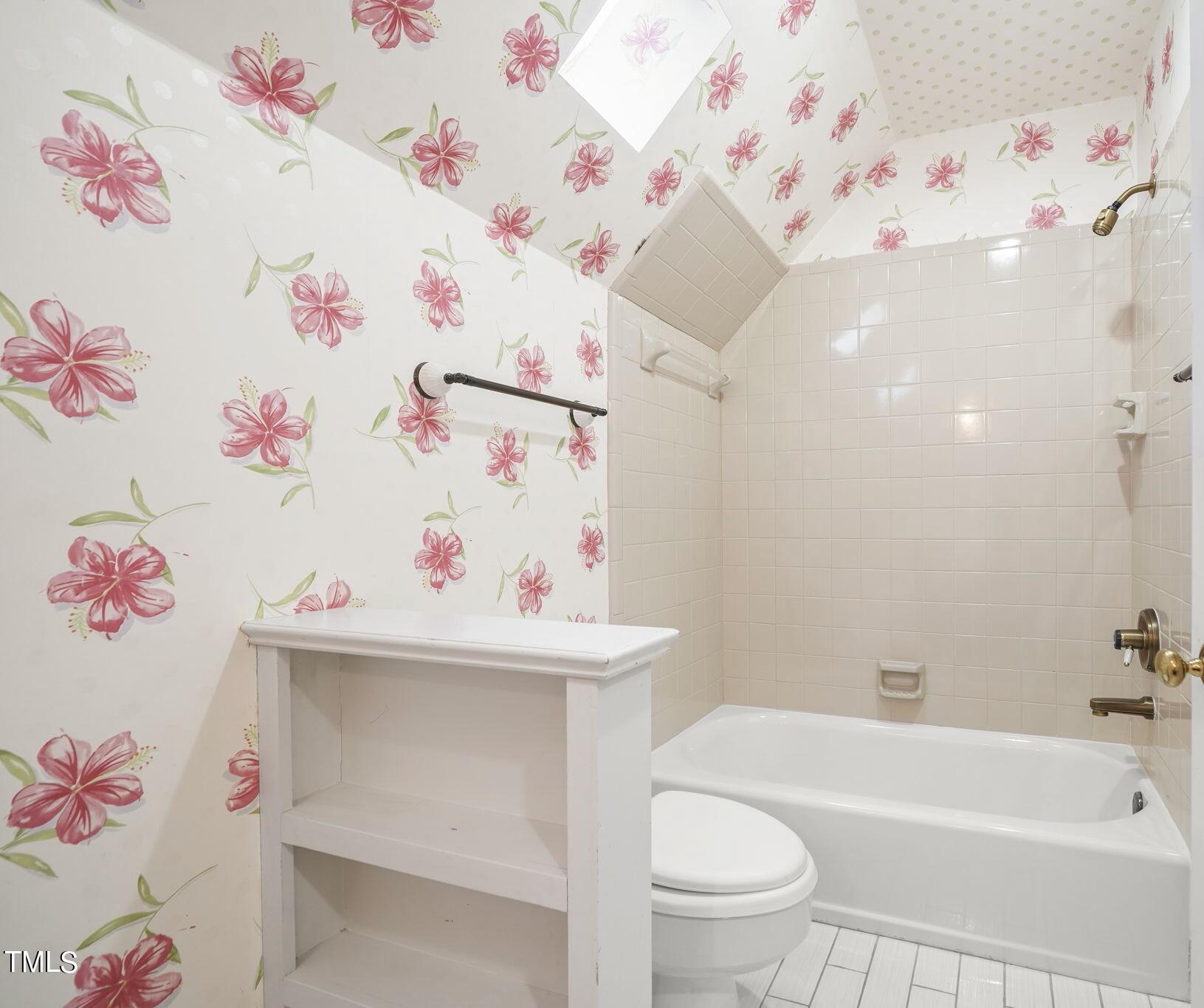3100 Eton Road Raleigh, NC 27608 - Photo 33 of 45 a bathroom with a sink a toilet and a curtain