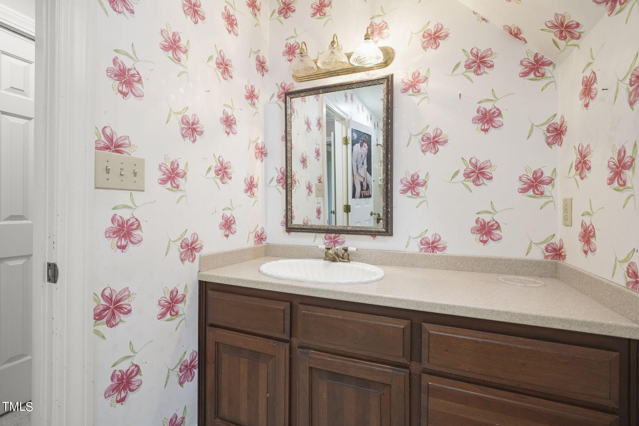 3100 Eton Road Raleigh, NC 27608 - Photo 34 of 45 a bathroom with a sink and a mirror