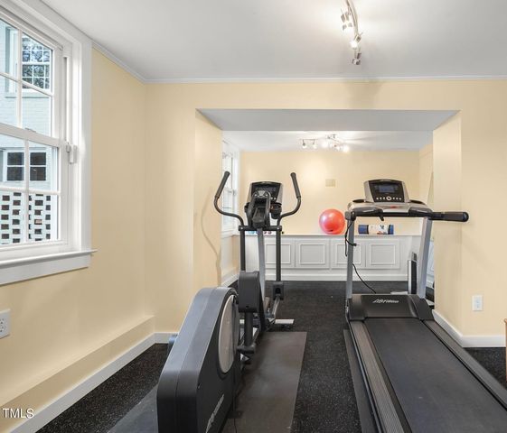 a view of gym equipment with windows