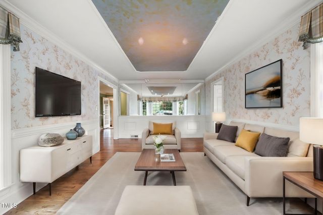 a view of a room with wooden floor and windows