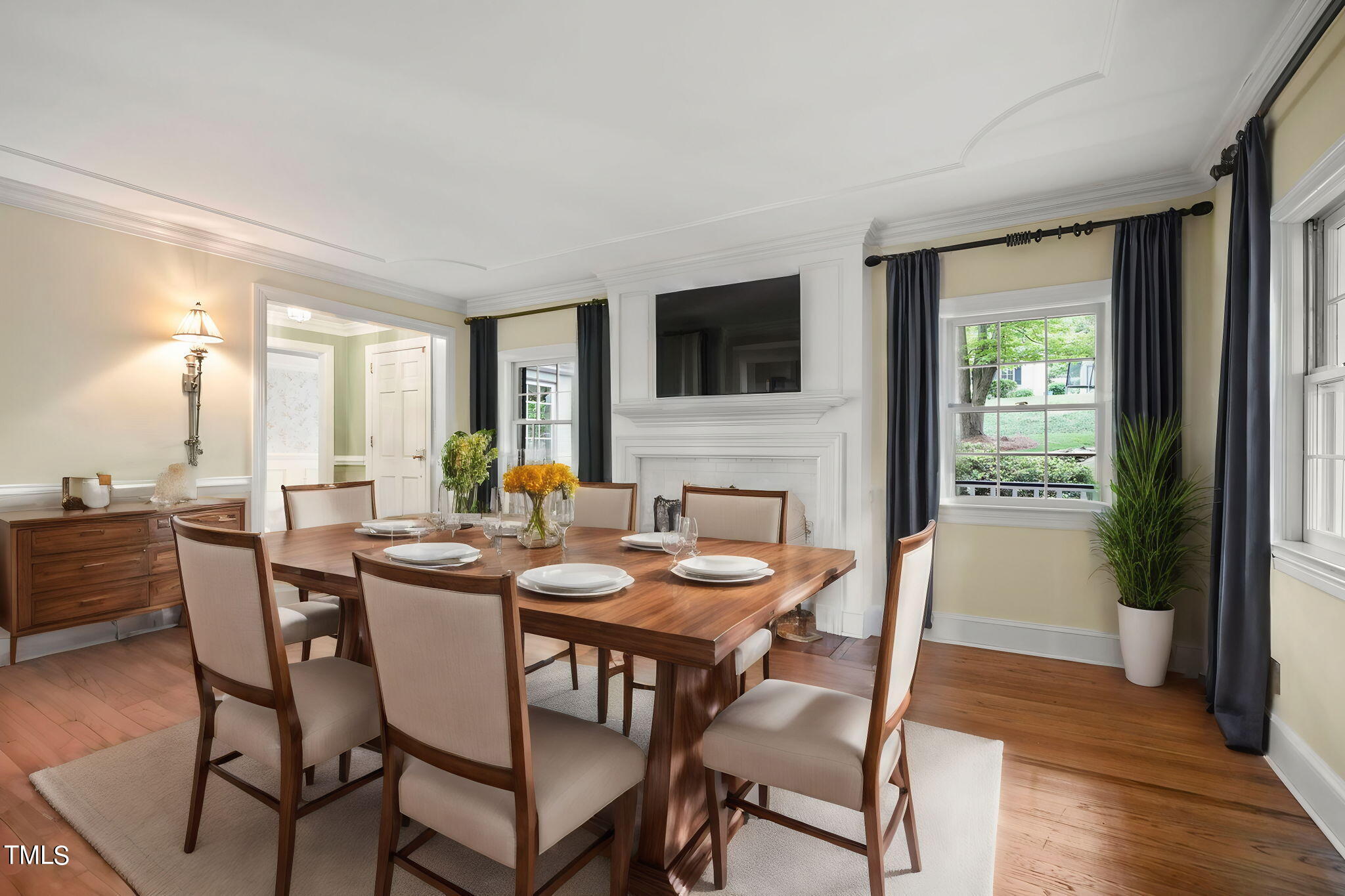 3100 Eton Road Raleigh, NC 27608 - Photo 8 of 45 a view of a dining room with furniture window and wooden floor