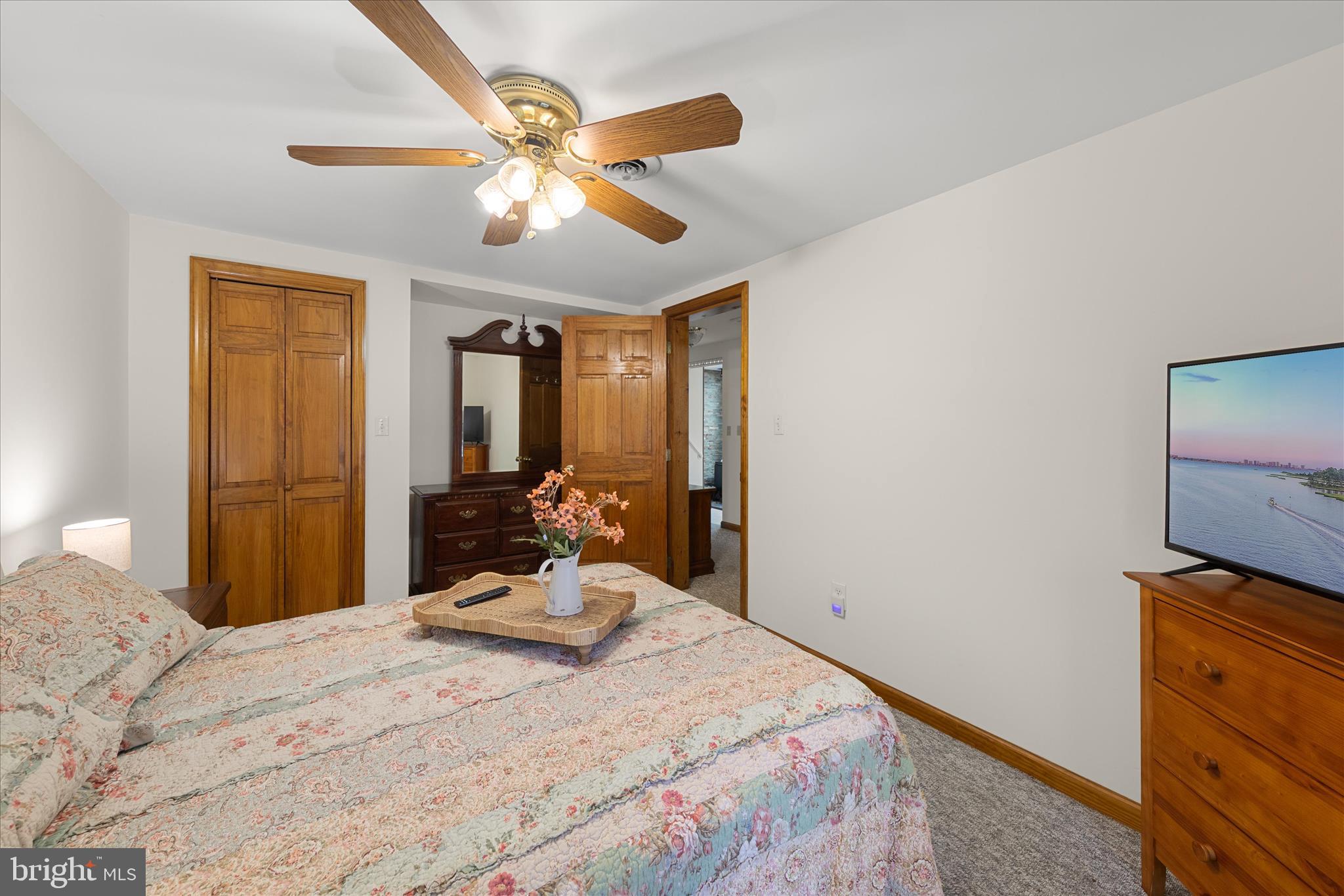 251 Rings End Road Millington, MD 21651 - Photo 19 of 47 a bedroom with a bed and a chandelier