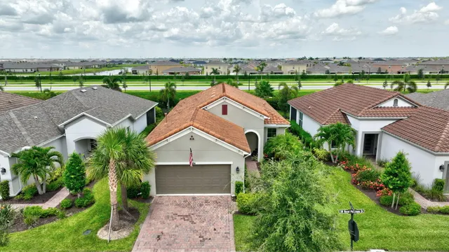 an aerial view of a house with outdoor space and street view