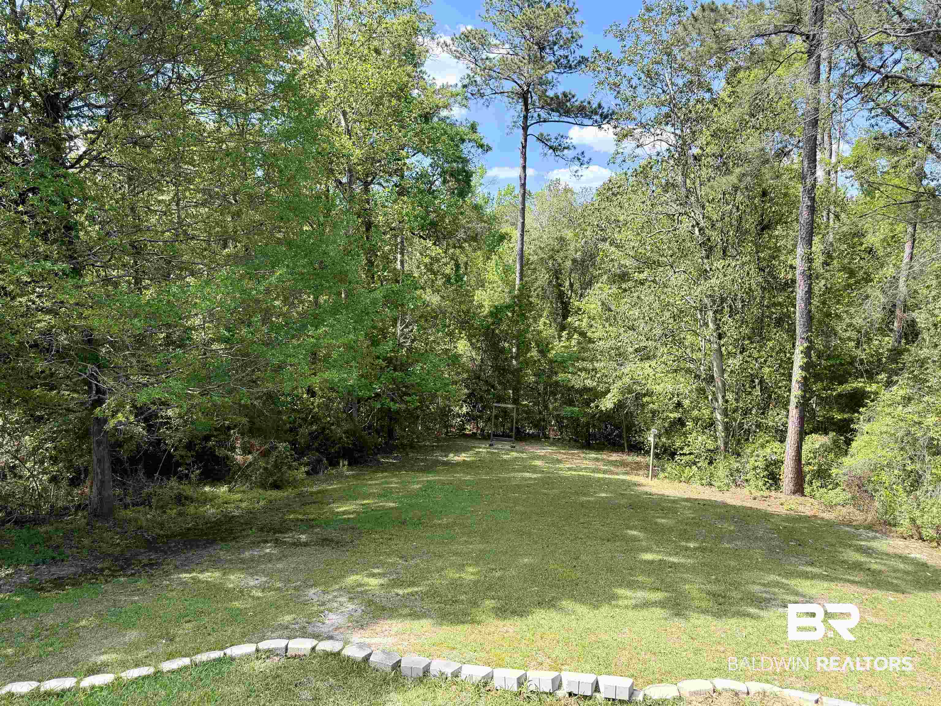 2944 Appleton Road Brewton, AL 36426 - Photo 52 of 65 View of green lawn featuring a forest view