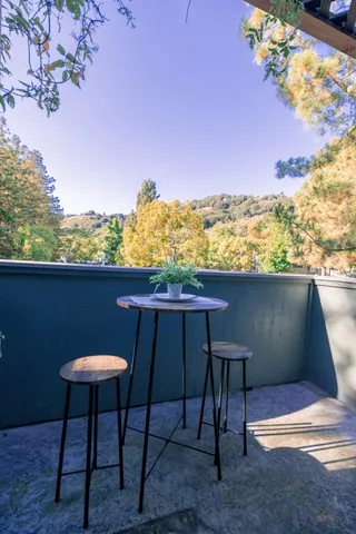 a view of a chairs and table in the patio