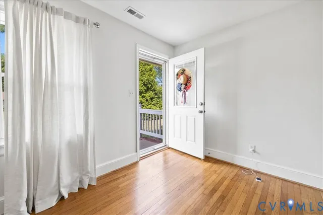 a view of entryway with wooden floor