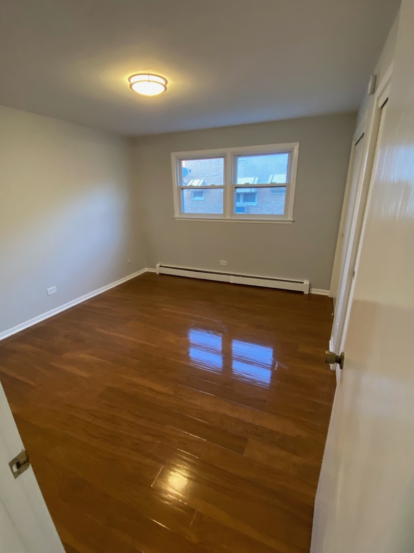 5822 West 79th Street, Unit 1 Burbank, IL 60459 - Photo 3 of 5 a view of empty room with window