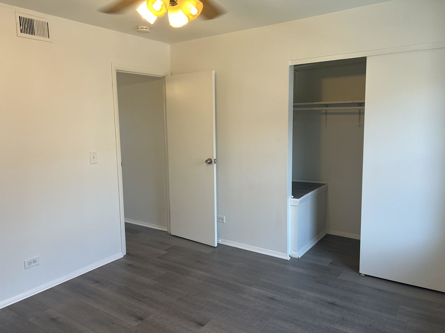 1713 Bristol Walk Hoffman Estates, IL 60169 - Photo 13 of 14 a view of an empty room with wooden floor and windows