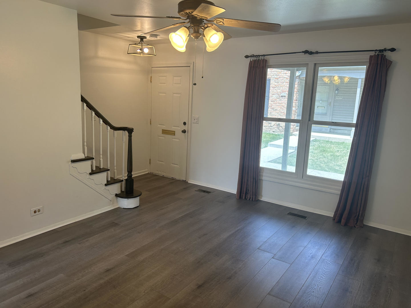 1713 Bristol Walk Hoffman Estates, IL 60169 - Photo 4 of 14 wooden floor in an empty room with a window