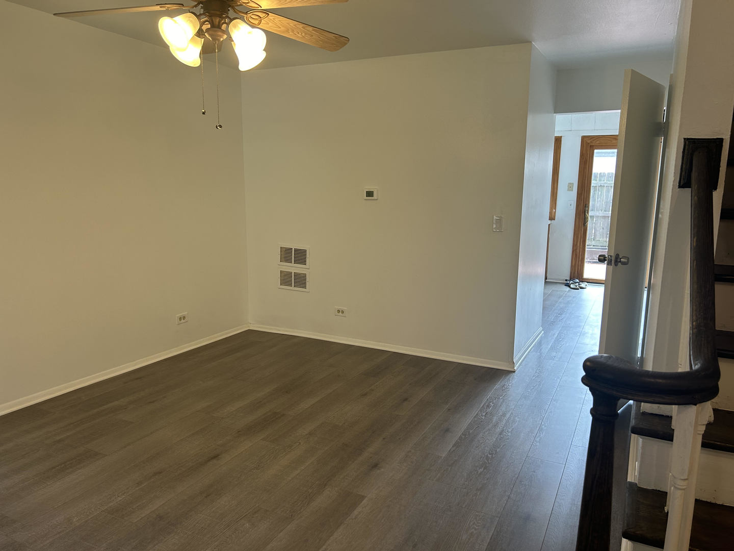 1713 Bristol Walk Hoffman Estates, IL 60169 - Photo 5 of 14 an empty room with wooden floor and mirror