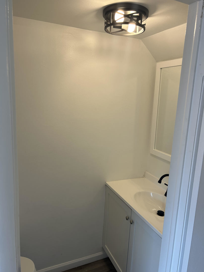 1713 Bristol Walk Hoffman Estates, IL 60169 - Photo 6 of 14 a bathroom with a sink and mirror