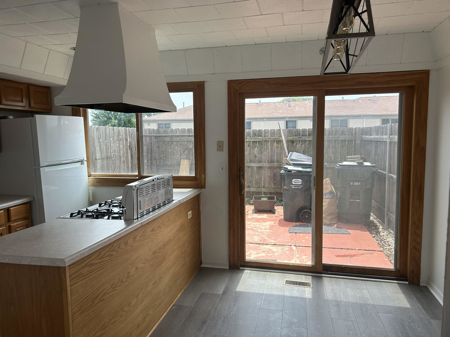 1713 Bristol Walk Hoffman Estates, IL 60169 - Photo 7 of 14 a kitchen with stainless steel appliances a counter space and a large window