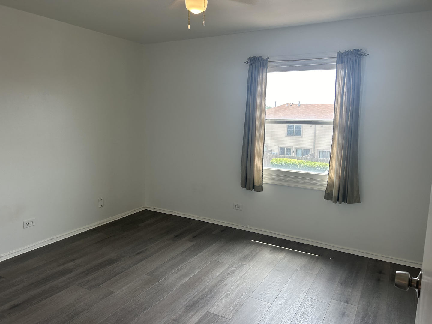 1713 Bristol Walk Hoffman Estates, IL 60169 - Photo 9 of 14 an empty room with wooden floor and windows