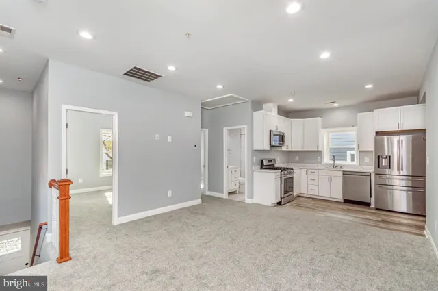 a view of a house with wooden deck