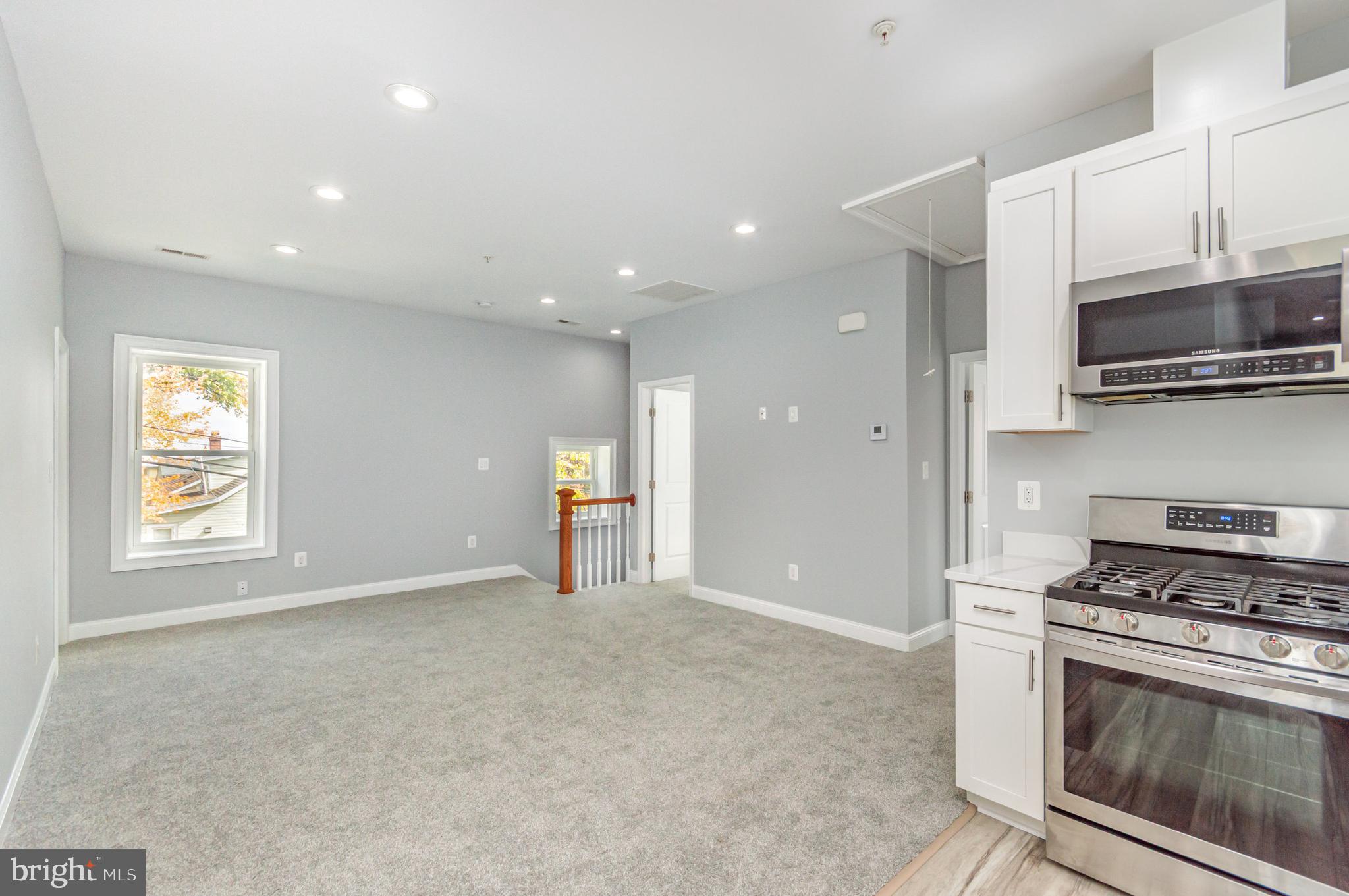 3110 Perry Street, Unit B Mount Rainier, MD 20712 - Photo 24 of 24 a view of kitchen with stove microwave and cabinets