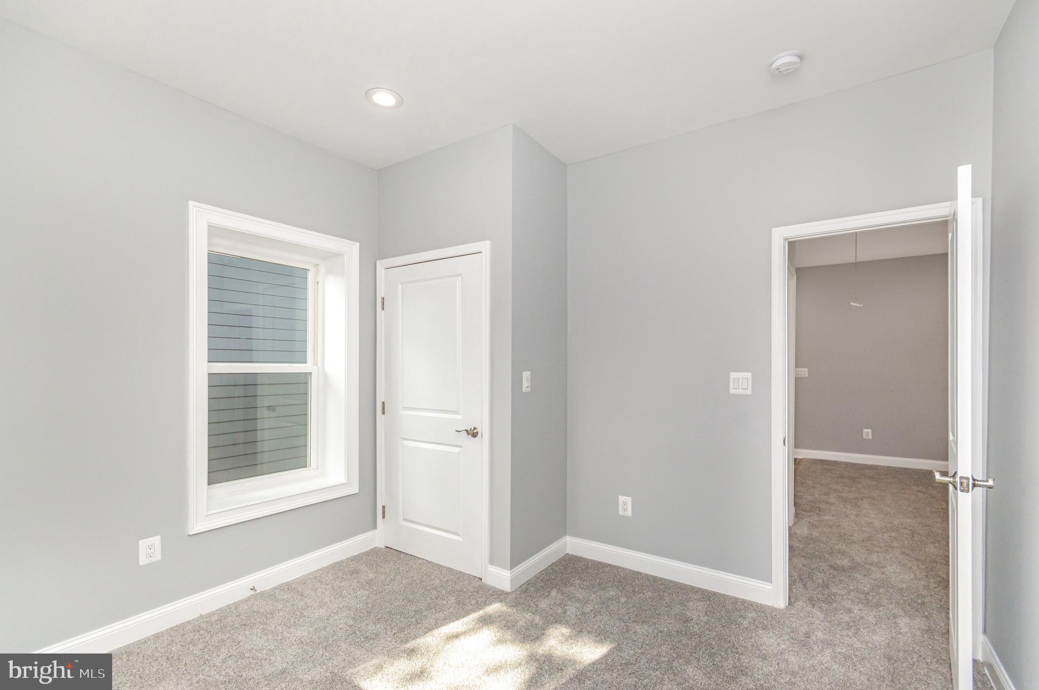 3110 Perry Street, Unit B Mount Rainier, MD 20712 - Photo 10 of 24 an empty room with windows and closet