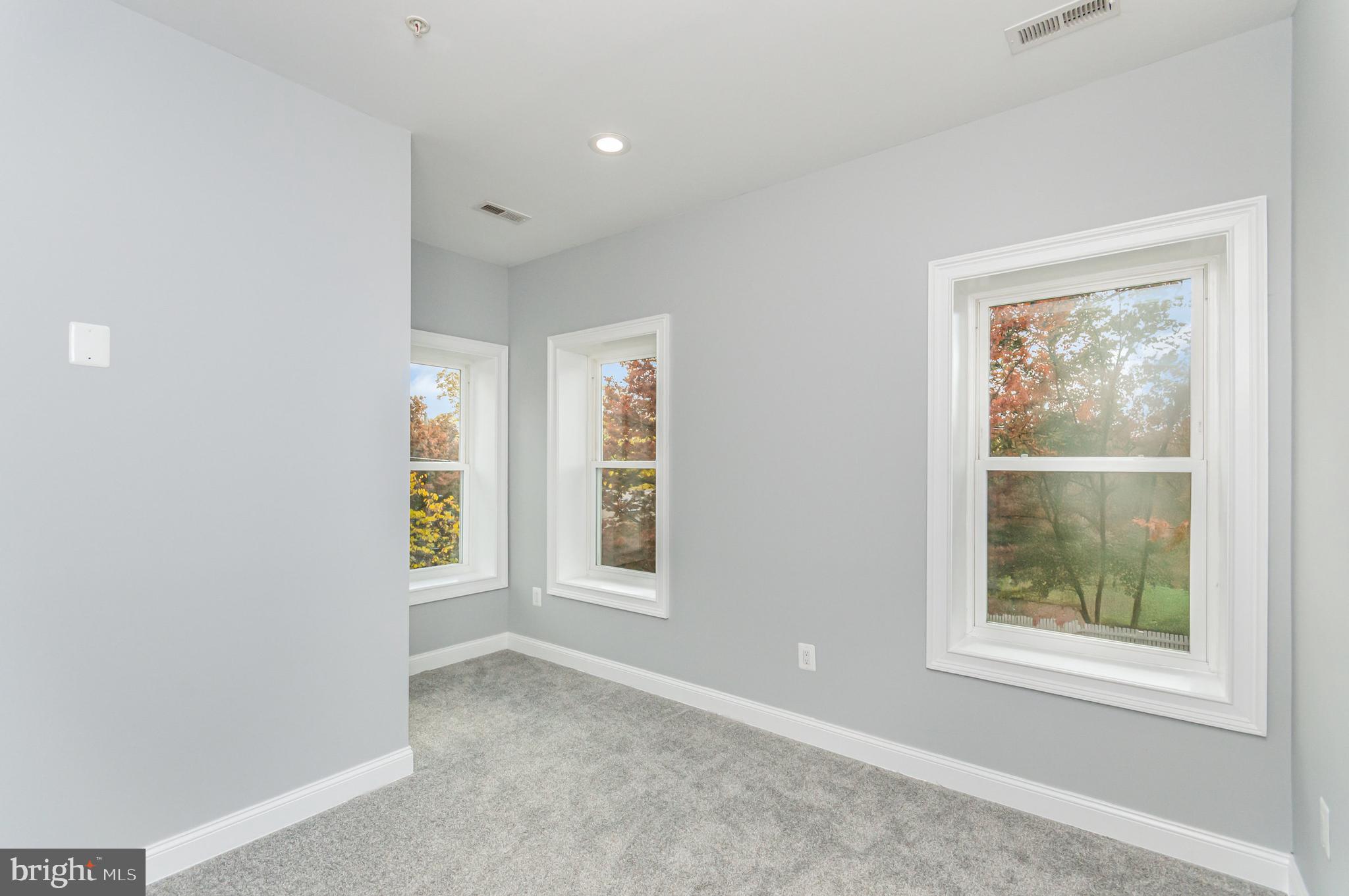 3110 Perry Street, Unit B Mount Rainier, MD 20712 - Photo 15 of 24 an empty room with windows