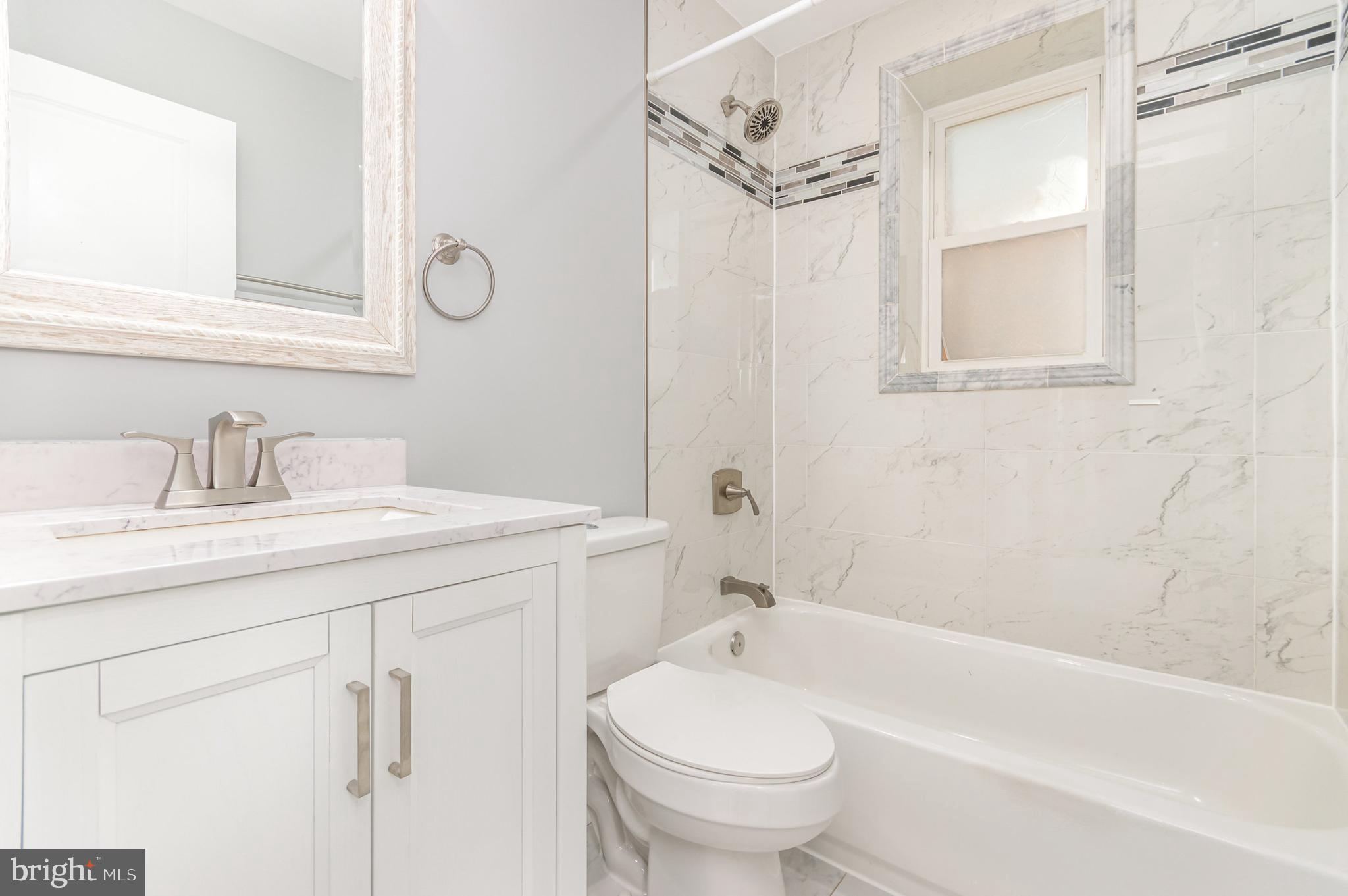 3110 Perry Street, Unit B Mount Rainier, MD 20712 - Photo 16 of 24 a bathroom with a sink toilet and shower