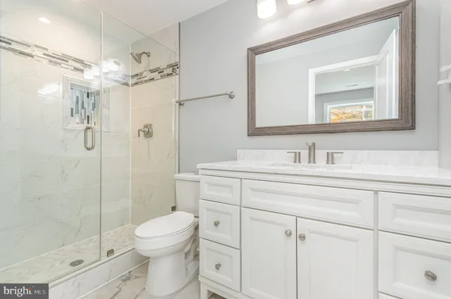 a kitchen with granite countertop a stove sink and microwave