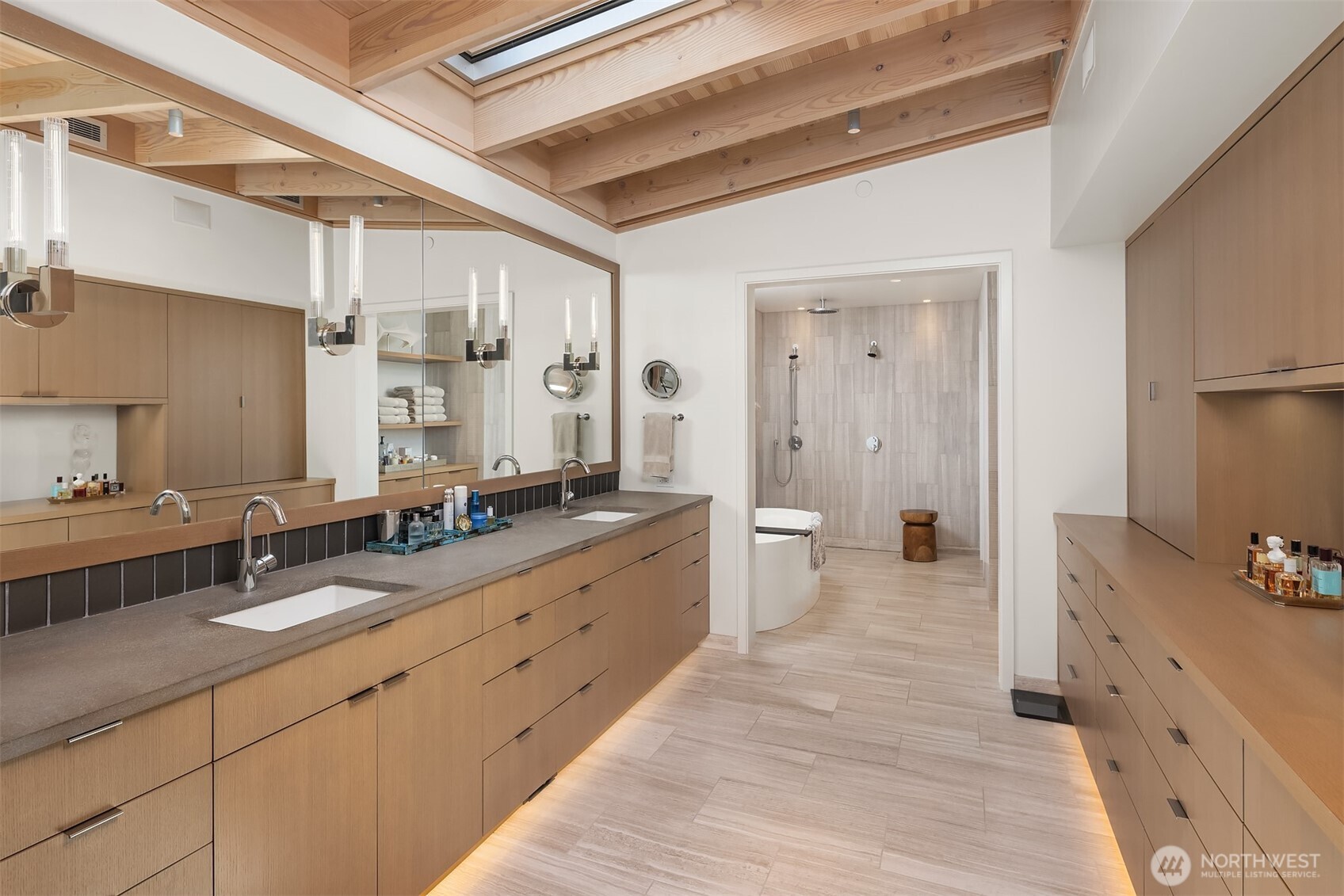 7964 East Mercer Way Mercer Island, WA 98040 - Photo 28 of 32 a spacious bathroom with a double vanity sink a mirror and a bathtub