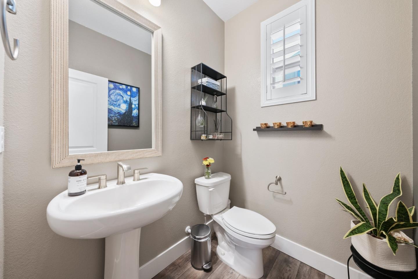 6725 Magnetic Loop San Jose, CA 95119 - Photo 19 of 68 a bathroom with a toilet a sink and a mirror