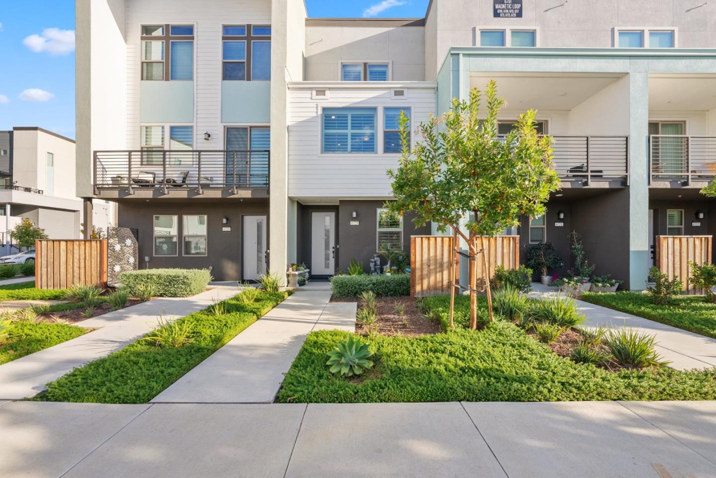 6725 Magnetic Loop San Jose, CA 95119 - Photo 2 of 68 a front view of a house with a yard