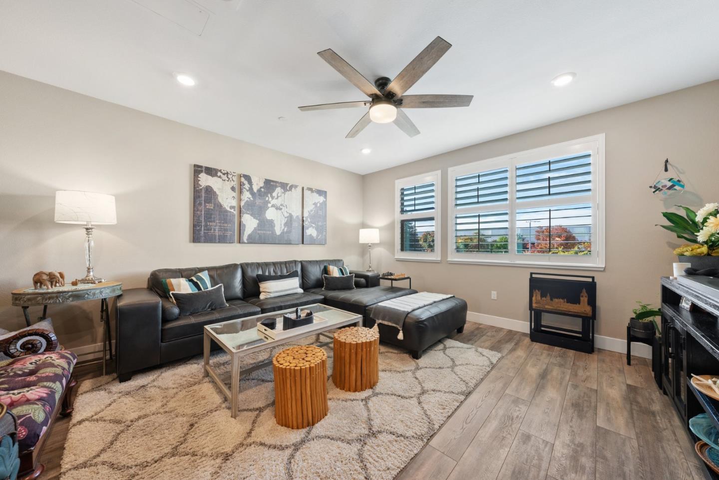 6725 Magnetic Loop San Jose, CA 95119 - Photo 24 of 68 a living room with furniture a fireplace and a large window