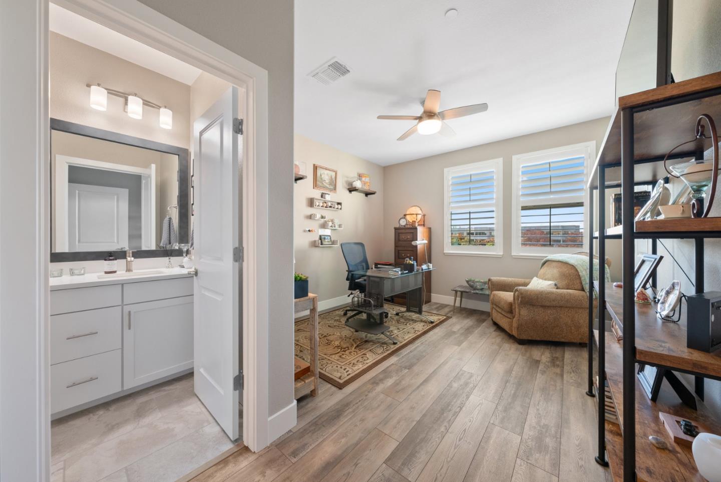 6725 Magnetic Loop San Jose, CA 95119 - Photo 29 of 68 a living room with furniture a fireplace and a flat screen tv