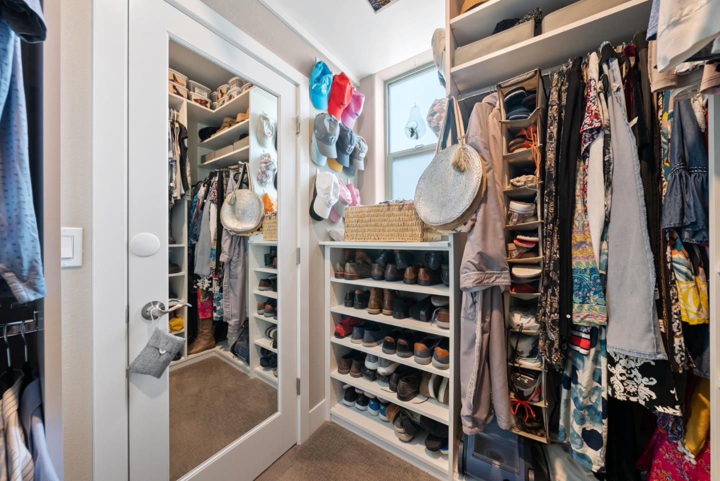6725 Magnetic Loop San Jose, CA 95119 - Photo 41 of 68 a view of walk in closet with clothes and shoes