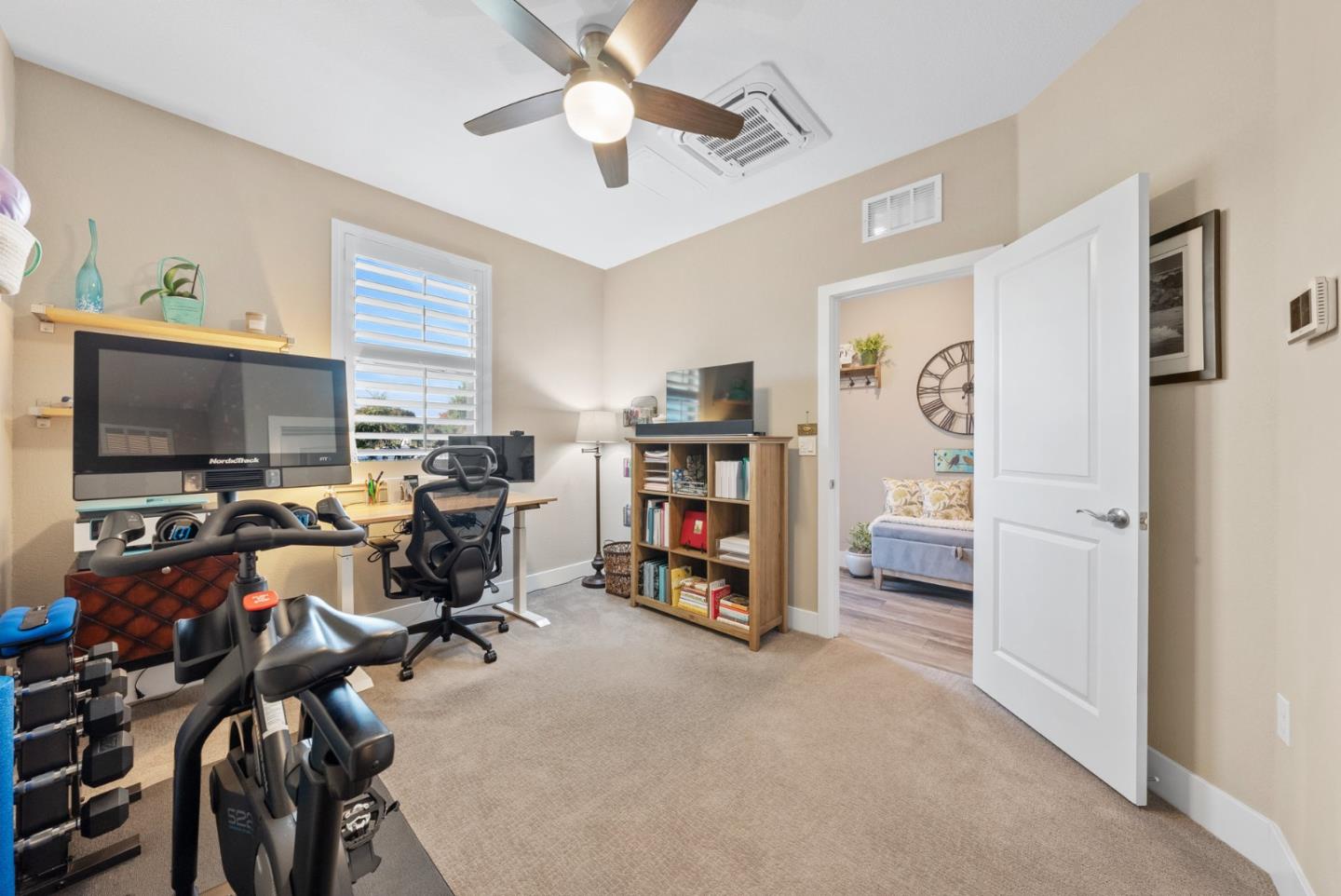 6725 Magnetic Loop San Jose, CA 95119 - Photo 5 of 68 a view of a livingroom with workspace and a window